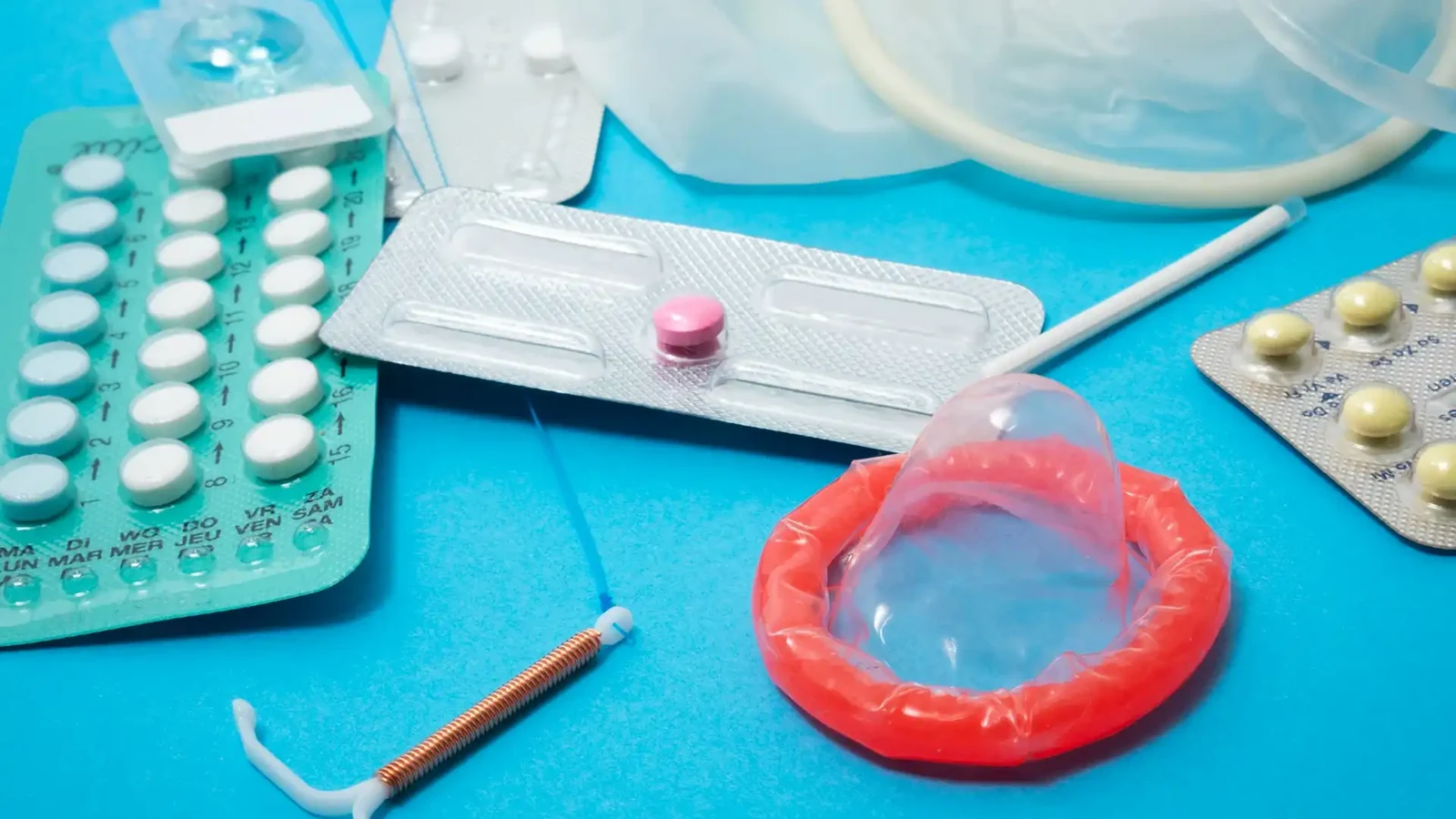 Combined and progestogen-only contraceptive pill packs alongside other contraception methods, illustrating the choices available